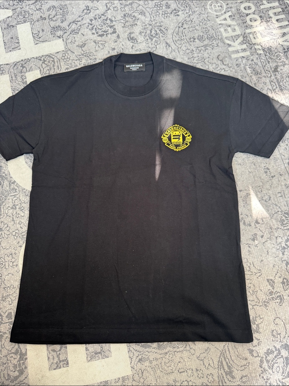Balenciaga Black Short Sleeve Tee with Yellow Chest Emblem